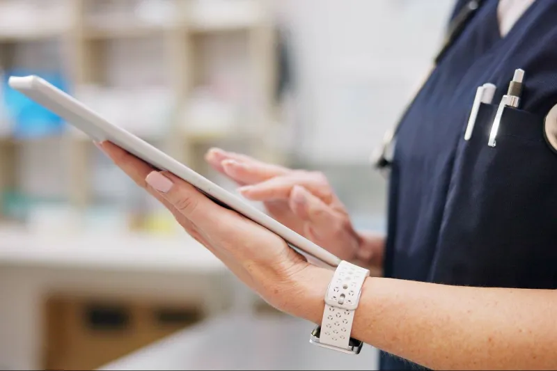vet with tablet in clinic for research