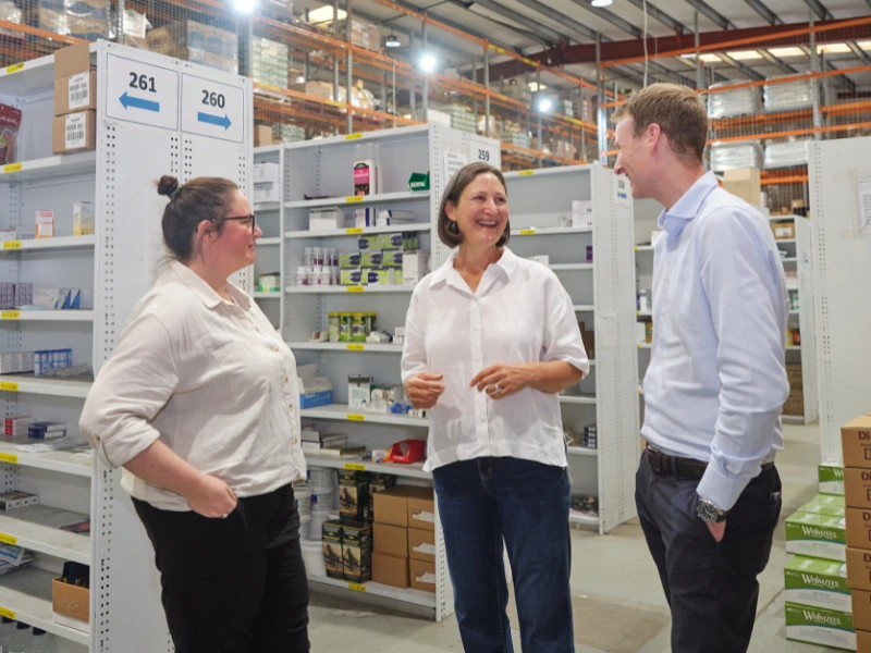 SVMG team meeting inside a veterinary supplier warehouse discussing industry partnerships and strategic marketing growth.